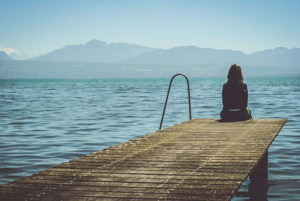 depression: woman on a pier