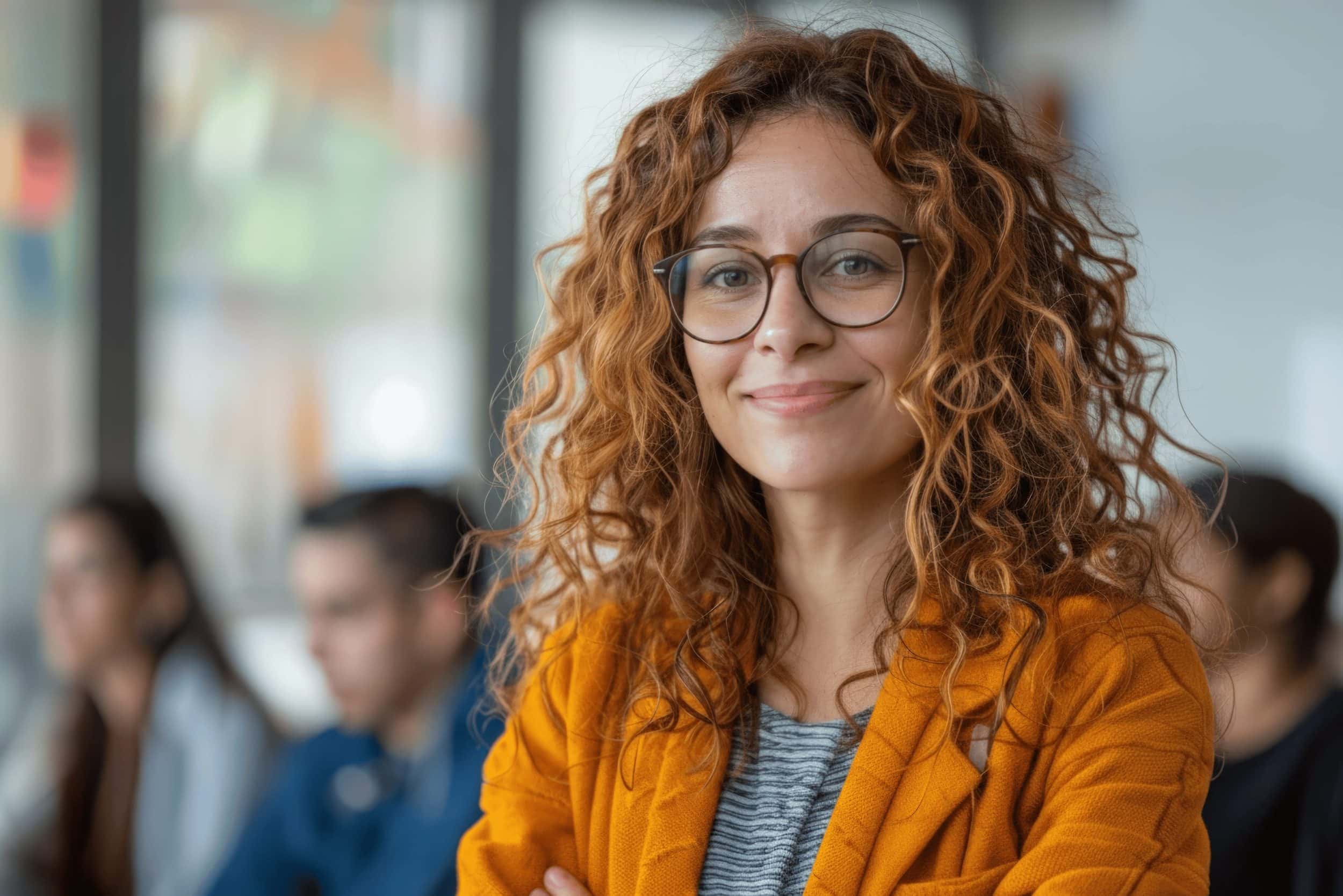 Woman smiling in an online therapy group session